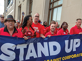 Eidlin thumb--UAW Stand Up sign