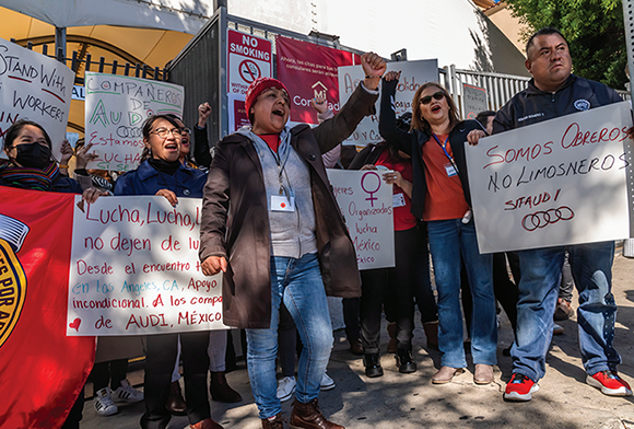 Domestic workers rallying in Los Angeles on behalf of striking workers at an Audi plant in Mexico, February 10, 2024.  Credit: © David Bacon. 